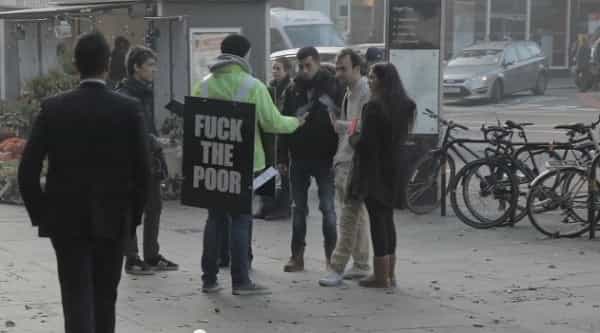 VIDEO: This “Fuck The Poor” Sign Enrages People Passing By But Watch What Happens Next VIDEO: This “Fuck The Poor” Sign Enrages People Passing By But Watch What Happens Next