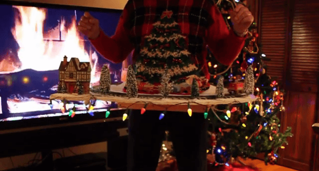 WATCH: This Man’s Ugly Christmas Jumper Is All Kinds Of (Practical) Genius