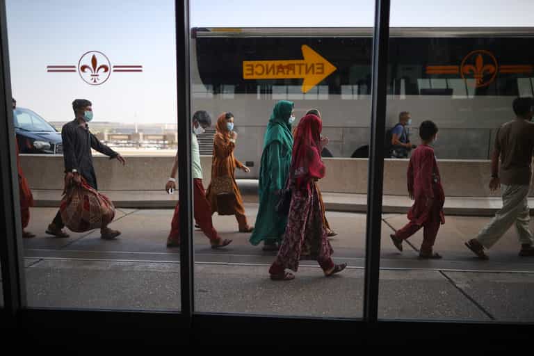 Baby boy lost in Afghan airport reunited with family