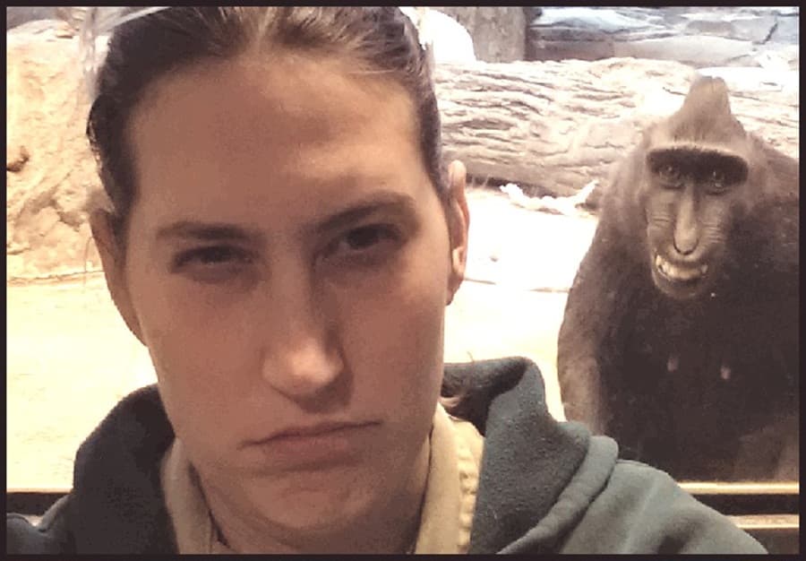 Photobombing, You’re Doing It Right: Naughty Monkey Pulls A Cheeky Grin In Zookeeper’s Snap