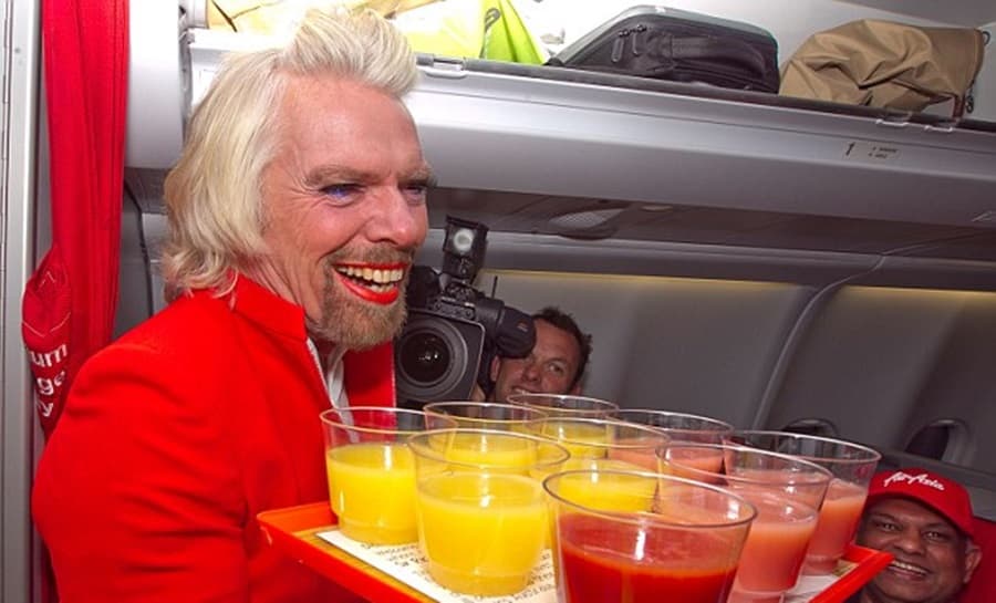 PHOTOS: Lippie, Dress And Shaved Legs… Why Is This Famous Millionaire Dressed Up As An Air Hostess?
