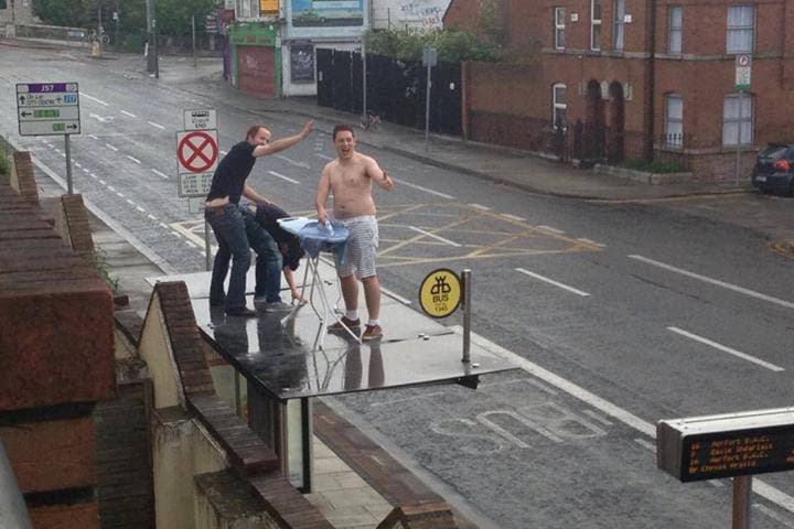 PICTURE: Just Some Lads, Ironing Atop a Bus Stop in Dublin