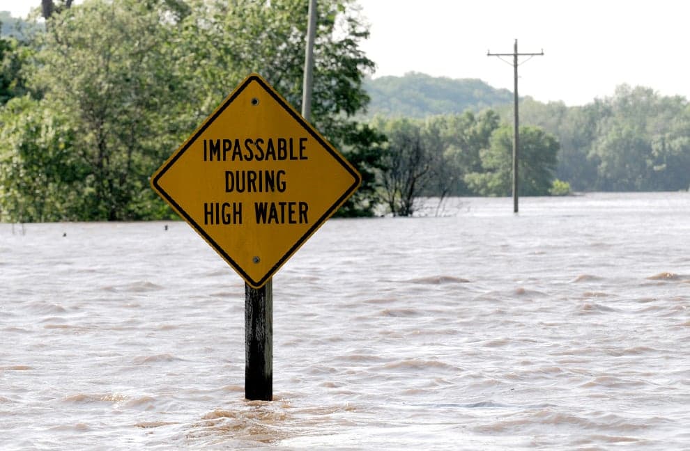 Adorable Photo: Young Boy Carries Dog To Prevent Him From Drowning In Flood Waters