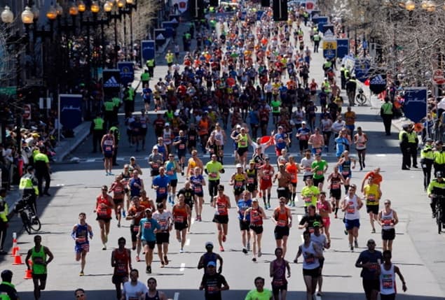 Pic Of The Day: Image Of Runner Being Carried Across The Finish Line Of The Boston Marathon Will Floor You