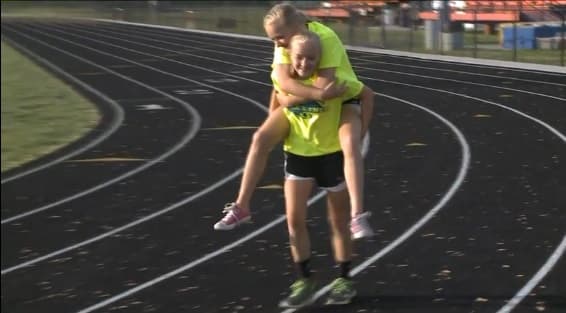 VIDEO: Twin Carries Injured Sister Across The Finish Line In 800m Race