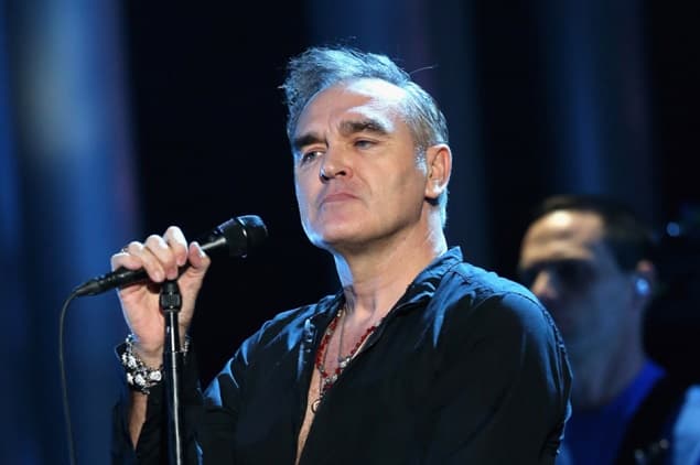 WATCH: Morrissey Escorted Away By Security As Fans Invade The Stage