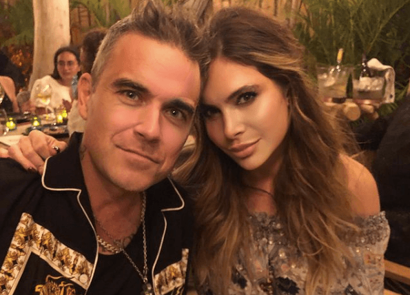 Robbie Williams “fairly sick” with Covid while holidaying in Caribbean