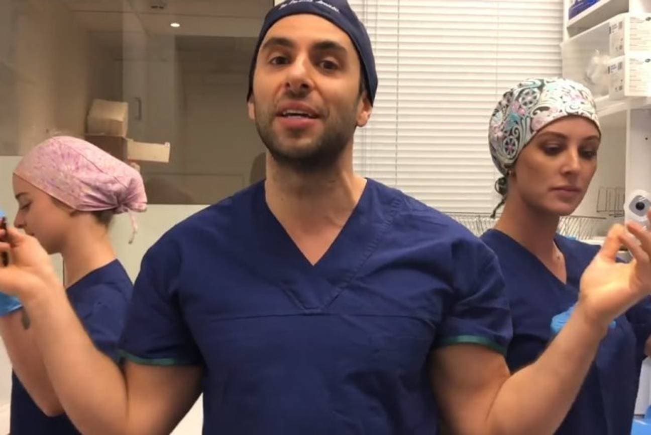 Doctor accused of making TikToks during surgeries banned from performing them