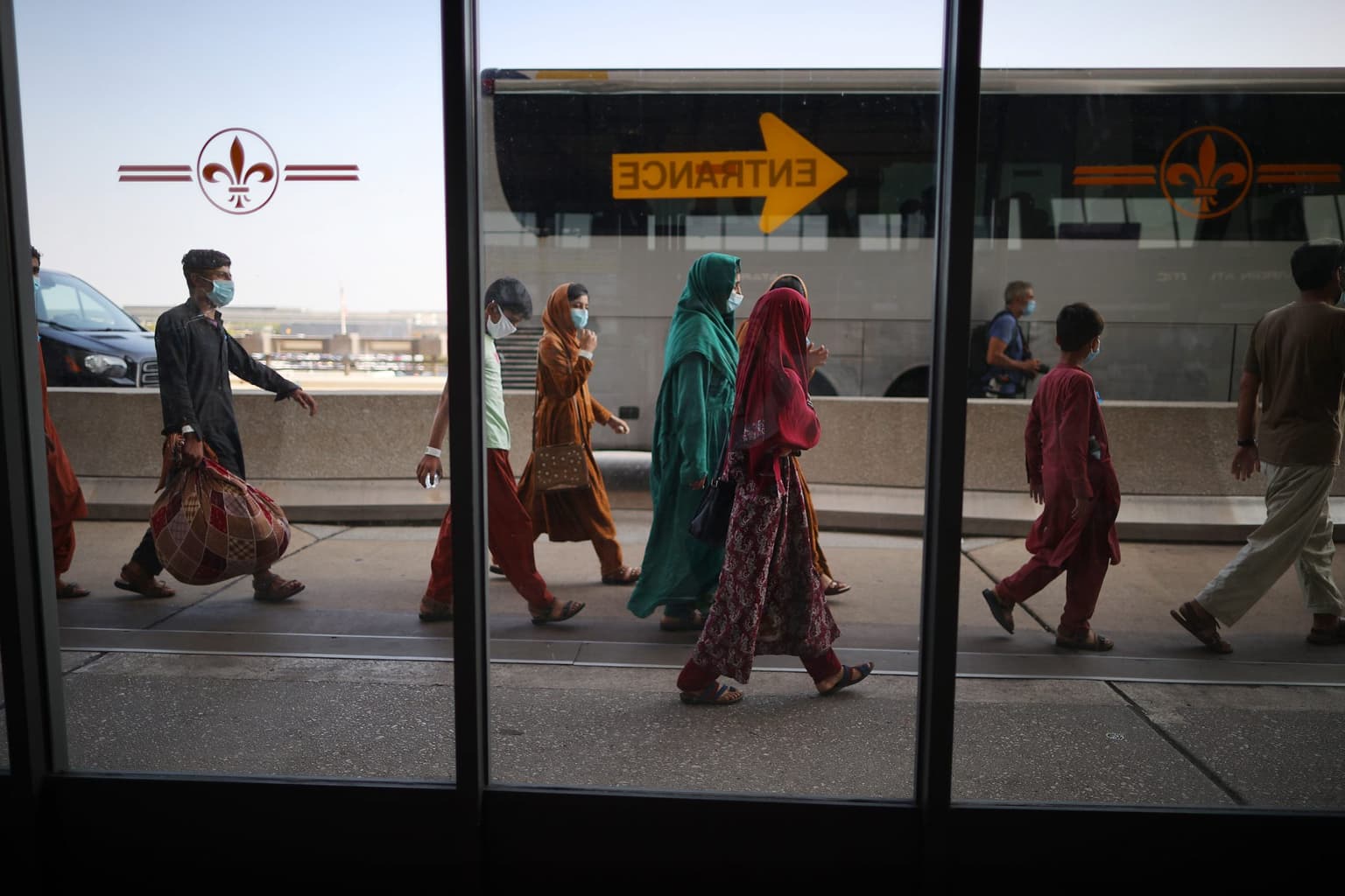 Baby boy lost in Afghan airport reunited with family