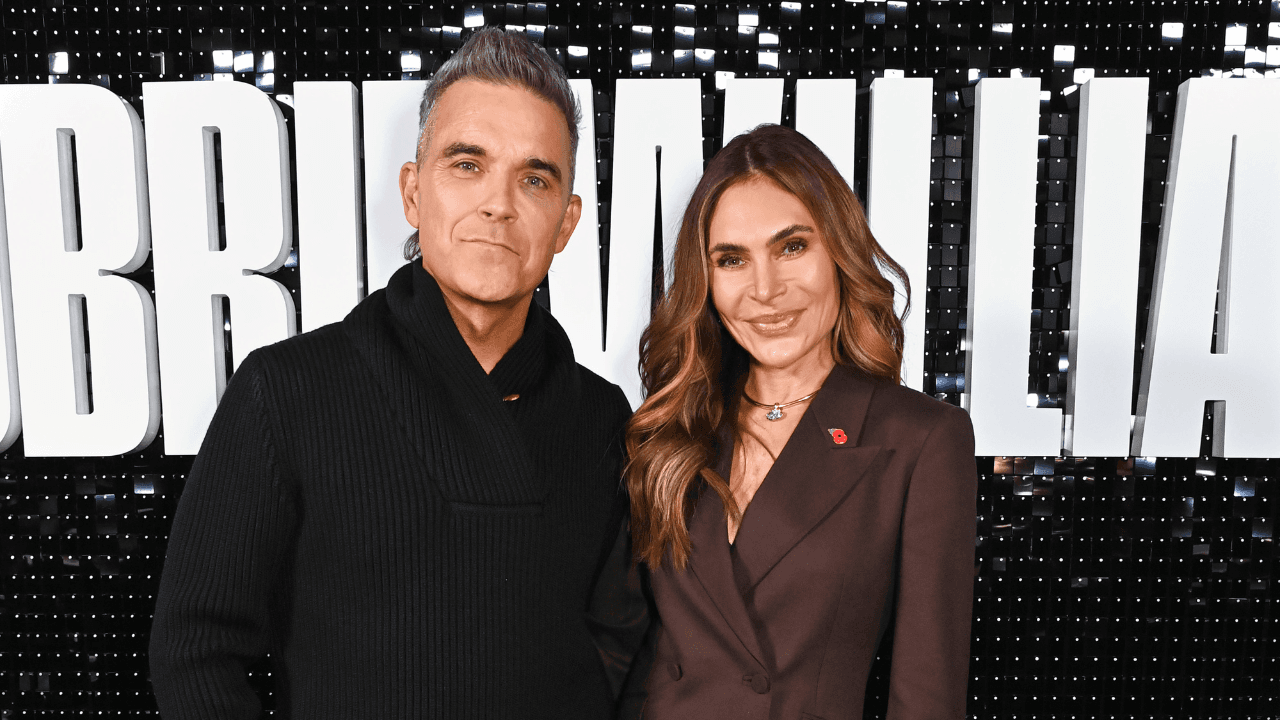 Robbie Williams embraces dad duty as he struggles with Christmas tree star