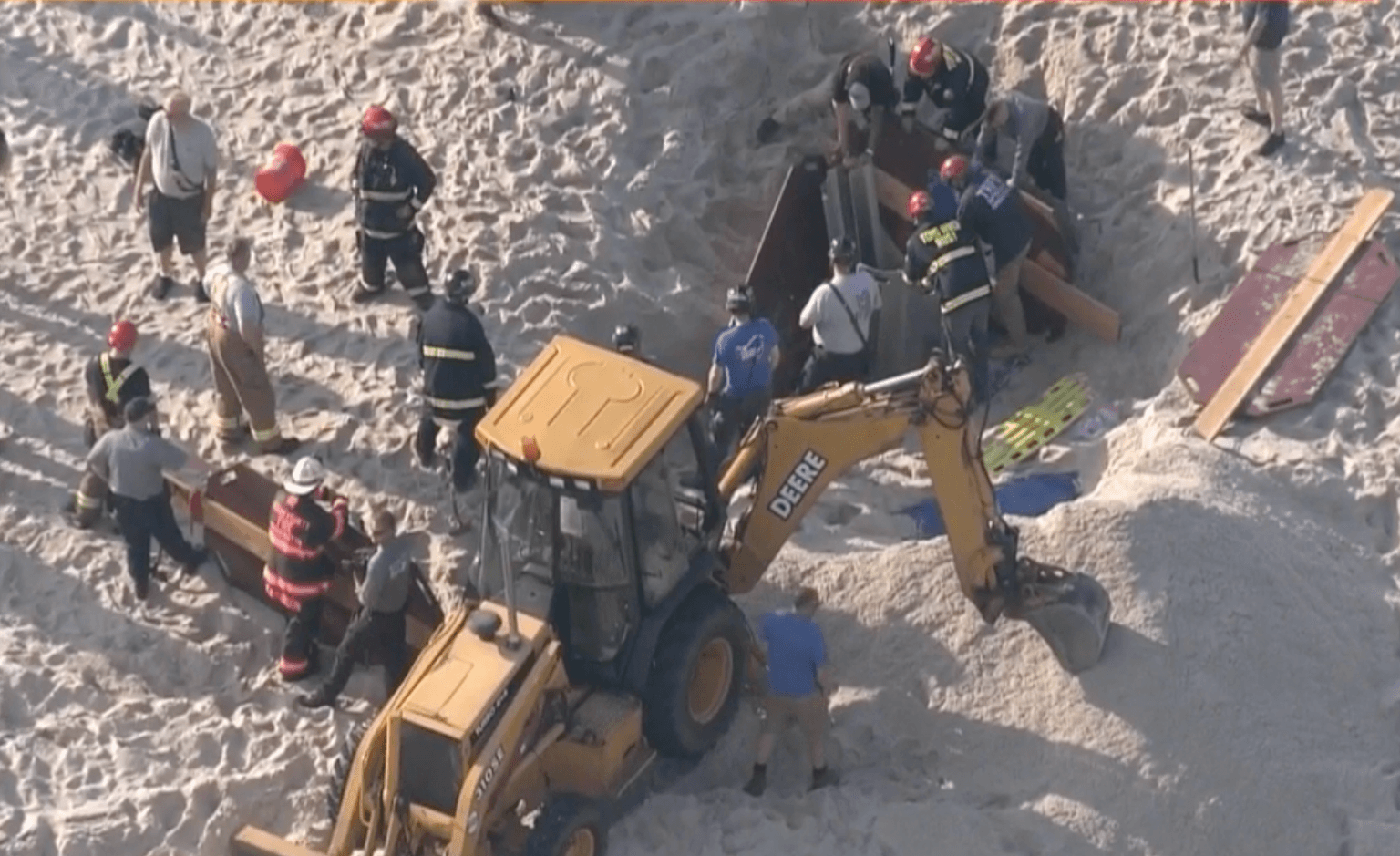 Teenager dies in sand collapse after digging hole on beach