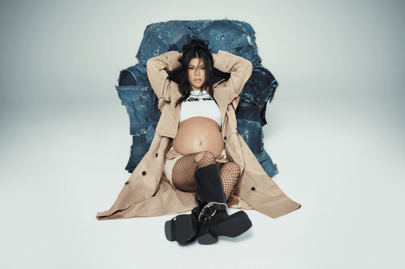 Kourtney Kardashian looks glowing as she poses pregnant for her latest Boohoo capsule