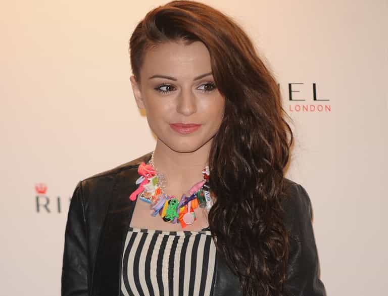 An Upset Cher Lloyd Leaves the V Festival Stage After Spectator Throws a Bottle of Urine at Her An Upset Cher Lloyd Leaves the V Festival Stage After Spectator Throws a Bottle of Urine at Her