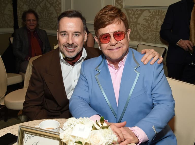 Elton John and husband David Furnish to receive lifetime achievement award for charity work Elton John and husband David Furnish to receive lifetime achievement award for charity work