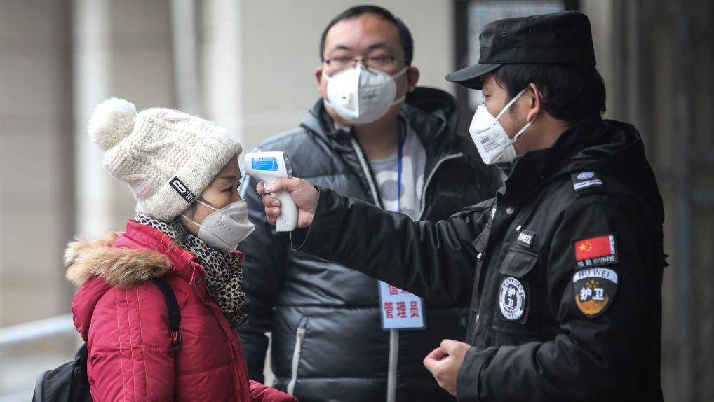 Ten Chinese cities locked down and Beijing celebrations scrapped as Wuhan virus death toll rises