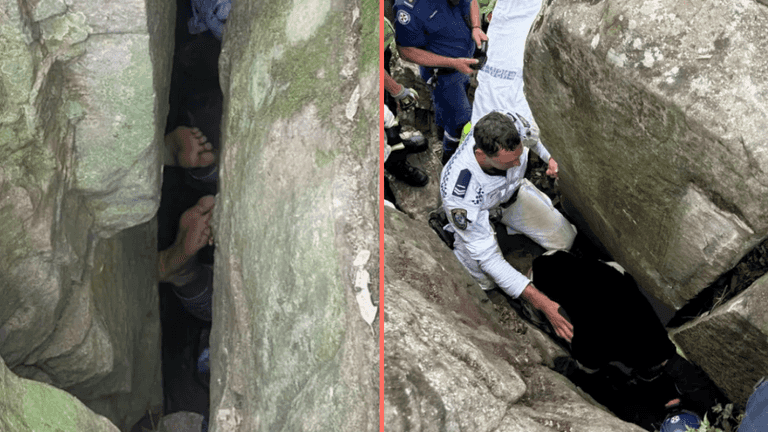 Woman trapped upside down between boulders for seven hours after trying to retrieve phone Woman trapped upside down between boulders for seven hours after trying to retrieve phone
